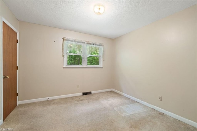1553 Carson Rd, Pilot Mountain, NC 27041 - carpeted empty room featuring baseboards and a textured ceiling