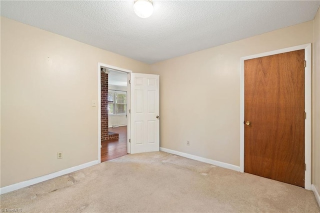 1553 Carson Rd, Pilot Mountain, NC 27041 - unfurnished bedroom featuring carpet flooring, baseboards, and a textured ceiling