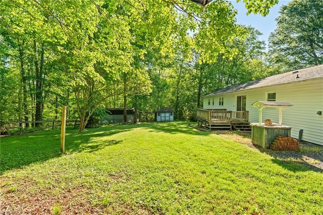 1553 Carson Rd, Pilot Mountain, NC 27041 - view of yard with a storage shed, a deck, and an outdoor structure