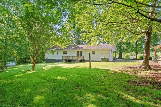 1553 Carson Rd, Pilot Mountain, NC 27041 - view of grassy yard with a wooden deck