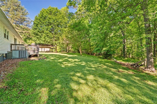 1553 Carson Rd, Pilot Mountain, NC 27041 - view of grassy yard featuring cooling unit and a deck