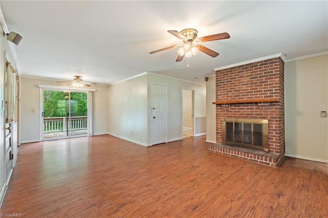 1553 Carson Rd, Pilot Mountain, NC 27041 - unfurnished living room with a ceiling fan, crown molding, wood finished floors, a brick fireplace, and baseboards