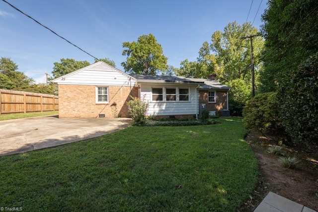 back of property featuring a yard and a patio