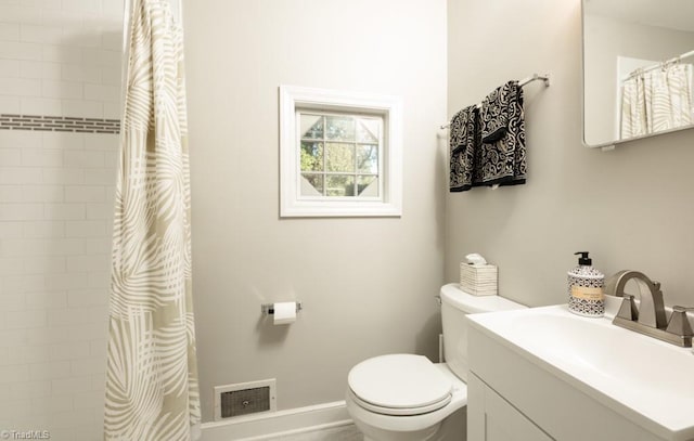 bathroom with vanity, toilet, and curtained shower