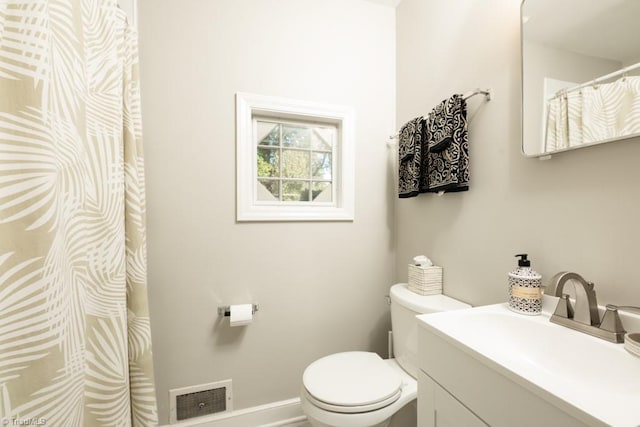 bathroom with toilet and vanity