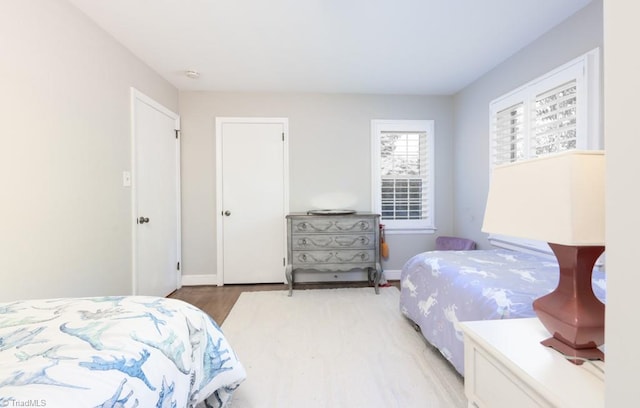 bedroom with hardwood / wood-style floors