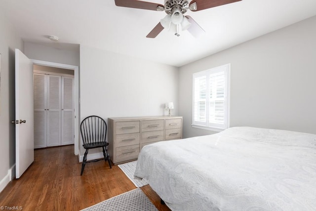 bedroom featuring dark wood-type flooring and ceiling fan