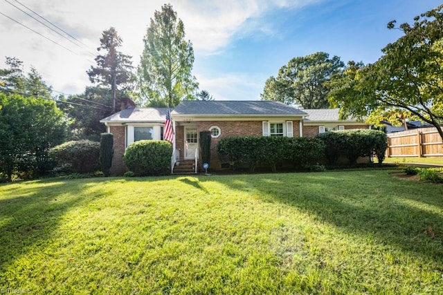 single story home featuring a front lawn