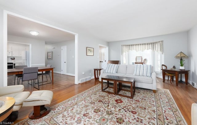 living room with light hardwood / wood-style floors