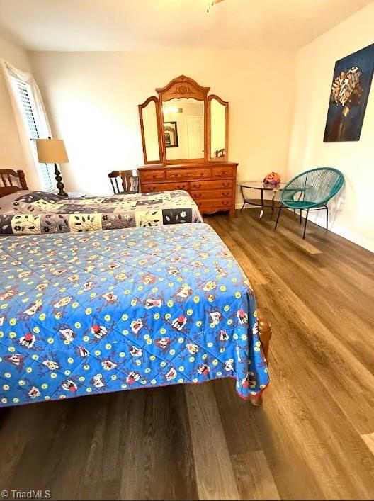 bedroom with wood finished floors