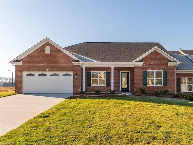 view of front facade with a garage and a front lawn