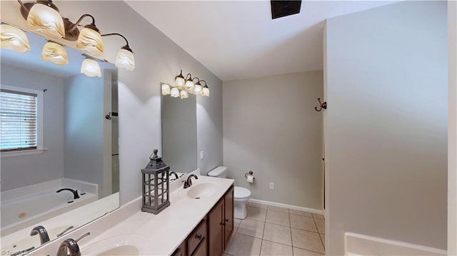 full bath featuring a sink, double vanity, toilet, a whirlpool tub, and tile patterned floors