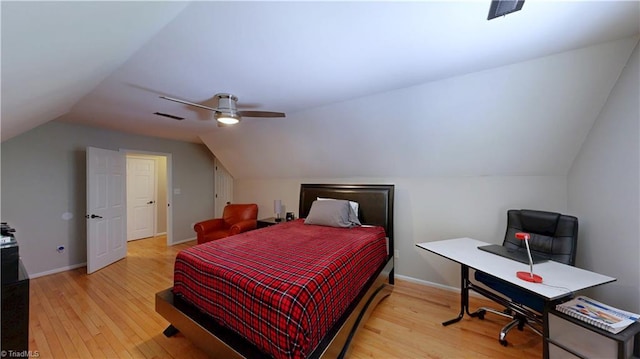 bedroom featuring lofted ceiling, wood finished floors, ceiling fan, and visible vents