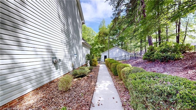 view of side of property featuring fence