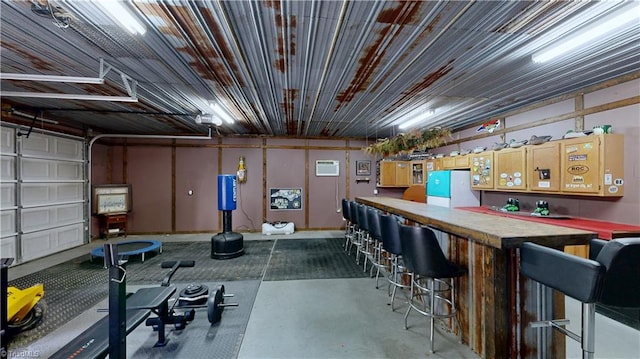 exercise room featuring a bar and an AC wall unit