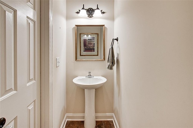 bathroom with sink and tile patterned flooring