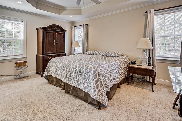 bedroom with multiple windows, light colored carpet, ceiling fan, and crown molding