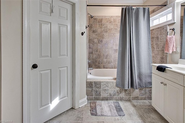 bathroom with tile patterned floors, shower / tub combo with curtain, and vanity