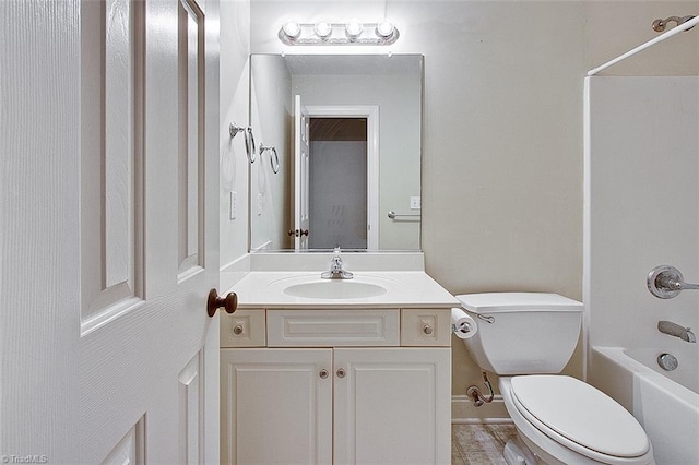 full bathroom featuring toilet, vanity, and bathing tub / shower combination