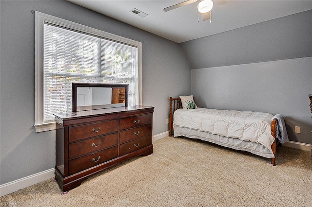 bedroom featuring ceiling fan, light carpet, and lofted ceiling