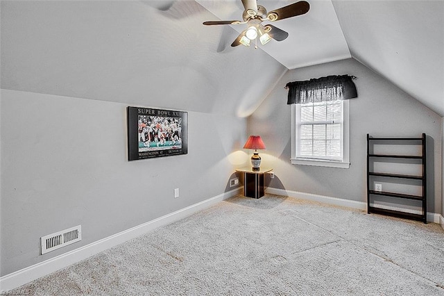 interior space featuring light carpet, ceiling fan, and lofted ceiling