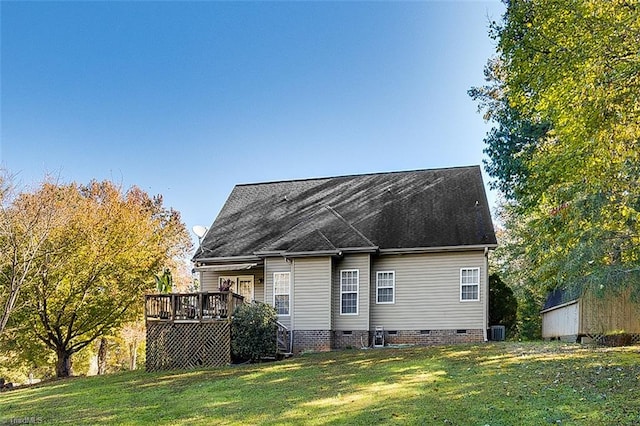 back of house featuring a lawn, cooling unit, and a deck