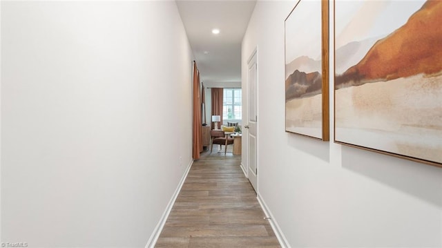 corridor with light hardwood / wood-style flooring