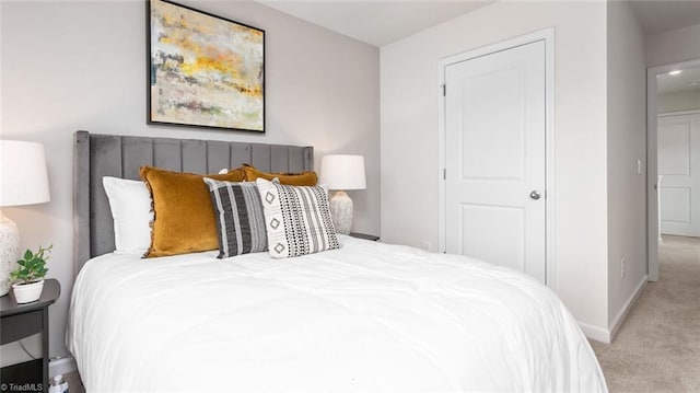 bedroom with light colored carpet