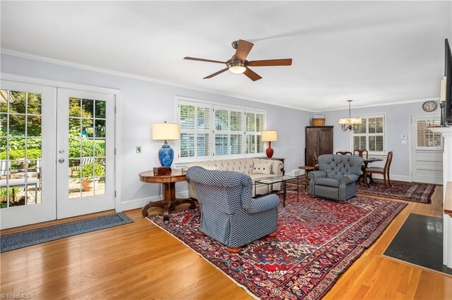 living room with hardwood / wood-style floors, french doors, and plenty of natural light