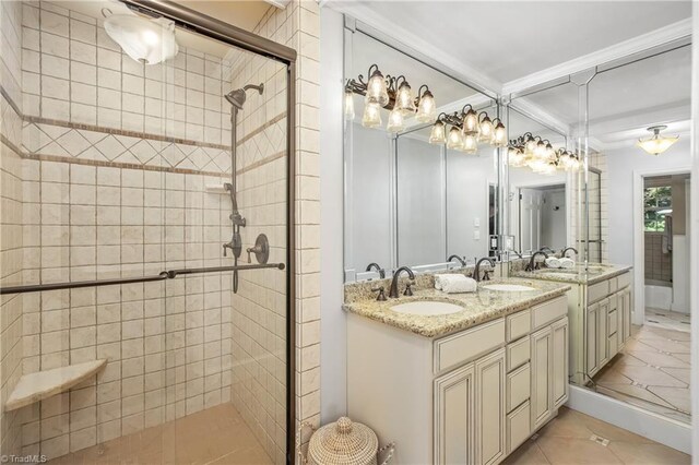 bathroom featuring double sink vanity, walk in shower, and tile patterned floors