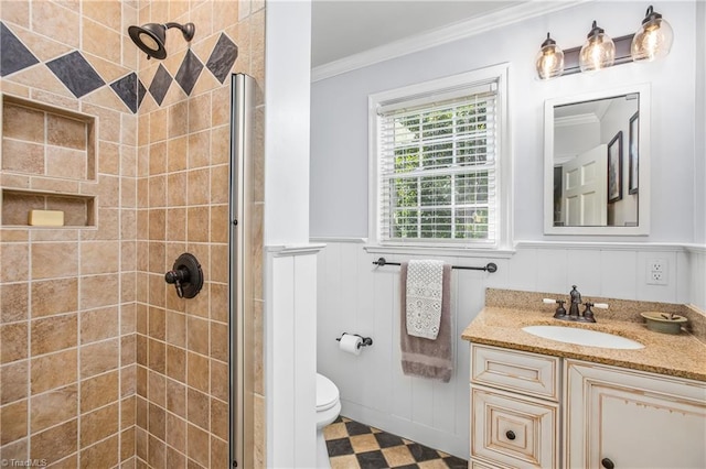 bathroom with a shower with door, toilet, tile patterned floors, vanity, and ornamental molding