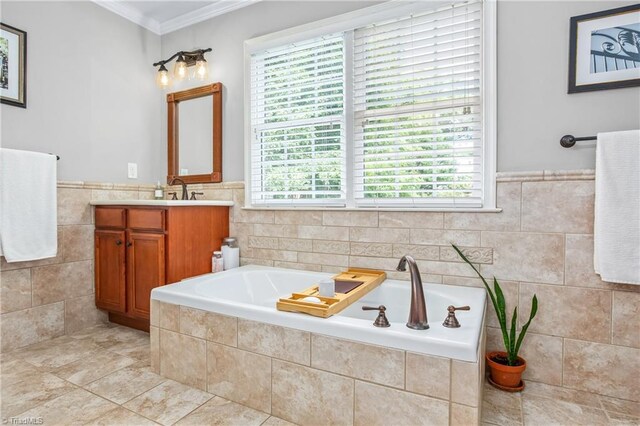 bathroom featuring crown molding, tiled bath, tile walls, tile patterned flooring, and vanity