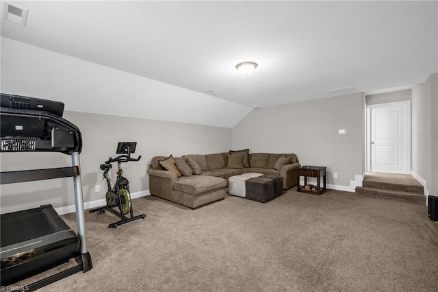 interior space featuring vaulted ceiling, visible vents, and baseboards