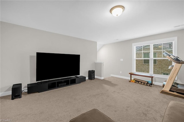 living area featuring carpet and baseboards