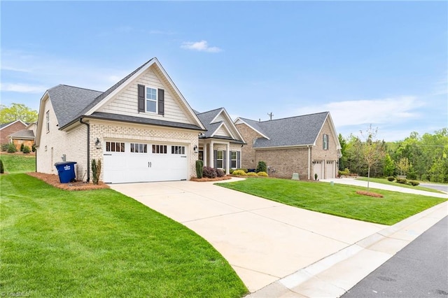 craftsman house featuring concrete driveway, brick siding, a front yard, and a garage