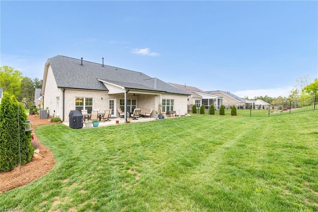 back of property featuring central AC unit, fence, a yard, a patio area, and ceiling fan