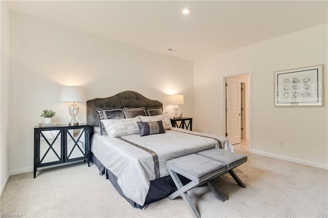 bedroom with recessed lighting, light colored carpet, and baseboards