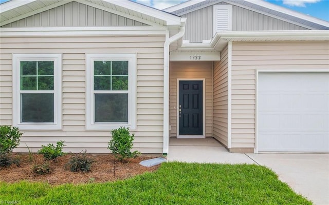 doorway to property featuring a garage