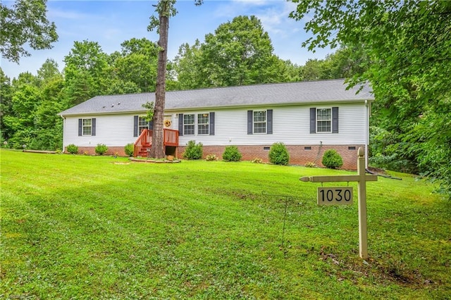 ranch-style home featuring a front yard