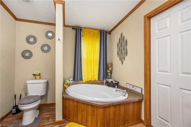 bathroom featuring a tub to relax in, crown molding, toilet, and hardwood / wood-style flooring