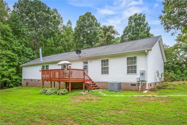 back of house with a lawn, central air condition unit, and a wooden deck