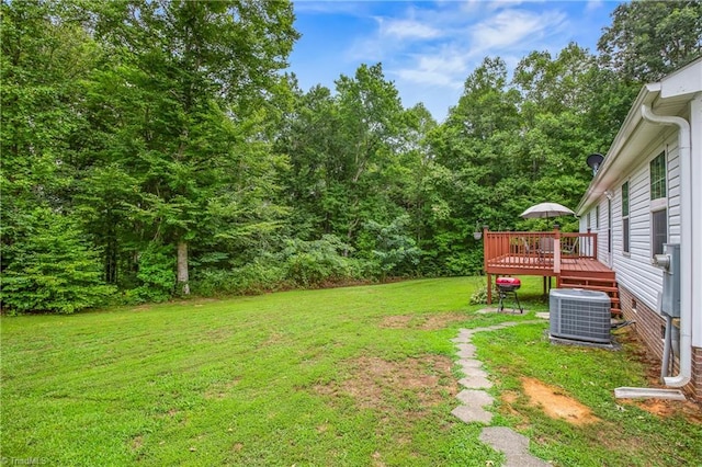 view of yard featuring cooling unit and a wooden deck