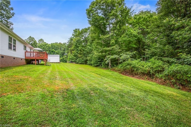 view of yard with a wooden deck