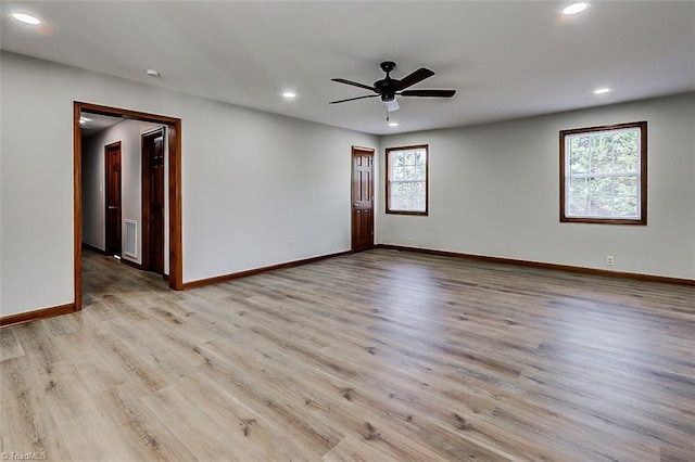 spare room with light wood finished floors, recessed lighting, visible vents, ceiling fan, and baseboards