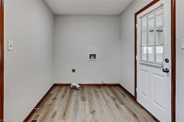 laundry room with baseboards, light wood-style flooring, washer hookup, and electric dryer hookup