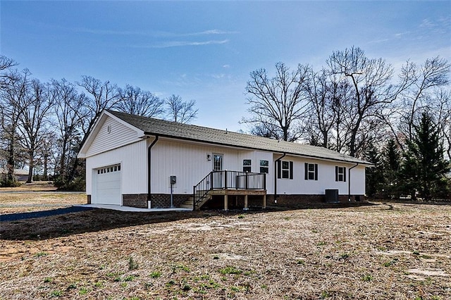 ranch-style home featuring a garage and driveway