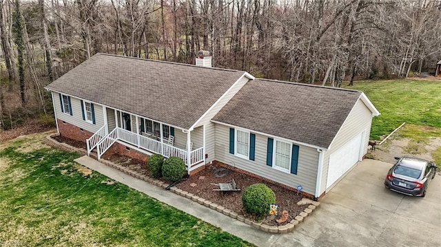 view of front facade with a porch, a shingled roof, concrete driveway, a front lawn, and crawl space