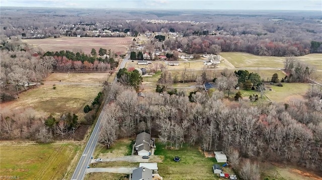 birds eye view of property with a rural view