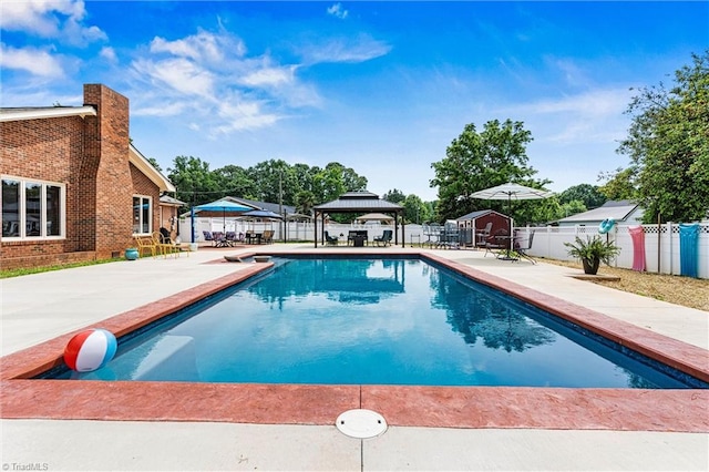 view of pool featuring a gazebo, a fenced backyard, and a patio