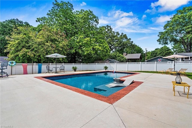view of pool featuring a patio and fence
